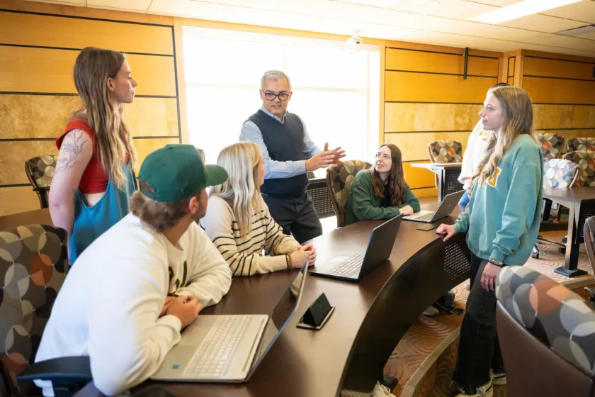 An instructor leads a discussion with students in an NDSU classroom.