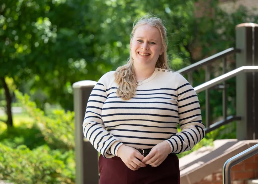 Olivia Svanes smiling confidently at camera.