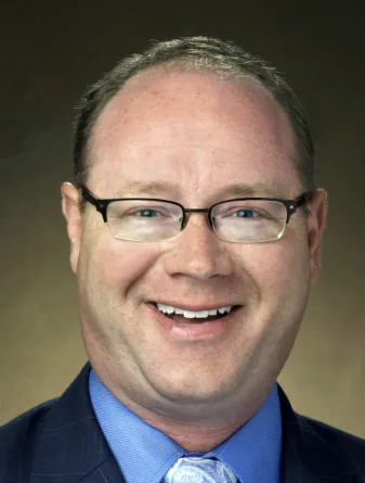 headshot of Travis Hoffman