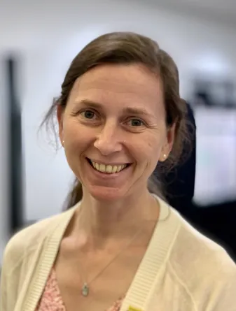 Jennifer smiling confidently at camera.