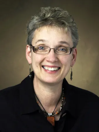 Susan Ray-Degges smiling confidently at the camera