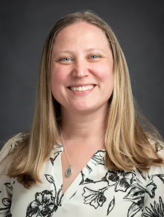 Anna Finley smiling confidently at camera.