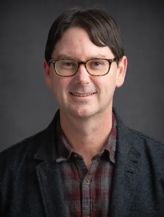 Jeffrey Johnson smiling confidently at camera. 