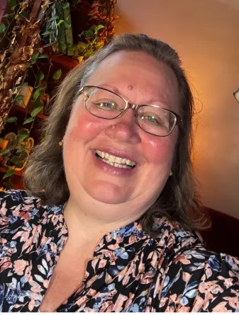 Krause smiling confidently at camera. 