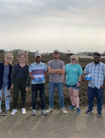 Syeed Iskander, NDSU assistant professor of civil, construction and environmental engineering, stands with a group of students.