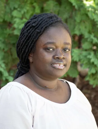 Lois smiling at the camera.