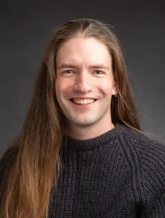 Matthew Dryburgh smiling confidently