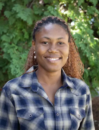 Dana is smiling at the camera.