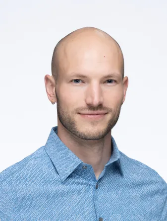 Jeremy smiling at the camera