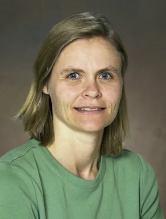 Angie smiling confidently at camera.