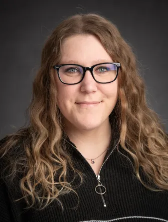 Dereka Bauscher in a black sweatshirt 