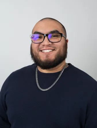 Carlos Roybal looking confidently into the camera.