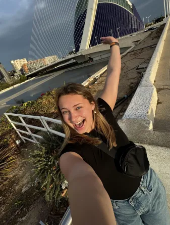 Student in front of bridge