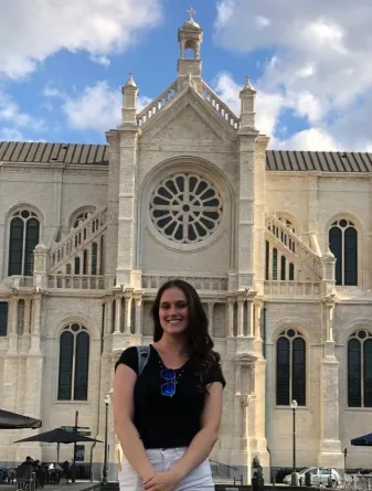 Student in front of church