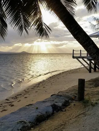 Beach with sun rays in the background