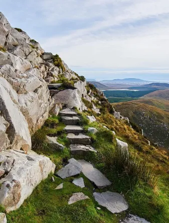 Scenic view from a rocky hill with stone steps next to it