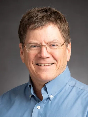 Steve Travers smiling confidently.