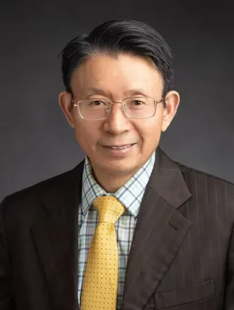 Dr. Yueh-Ting Lee confidently staring at the camera
