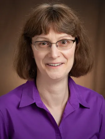 Woman in a purple shirt