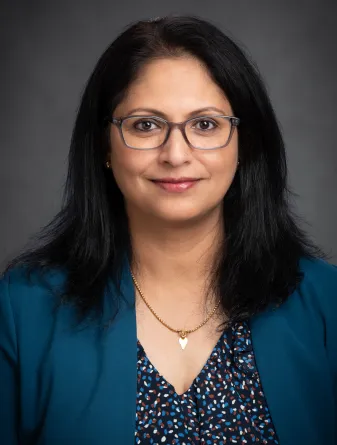Woman in a blue shirt and jacket