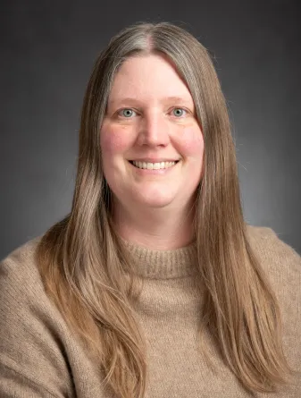 Woman in a tan sweater