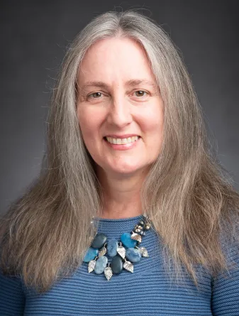 Laura Aldrich-Wolfe smiling confidently