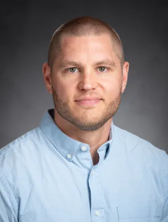 Dr. Nick Waters confidently staring at the camera