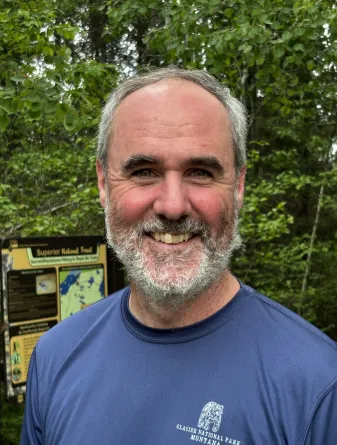 Tim Greives smiling confidently outdoors