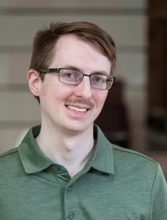 Man in light green shirt