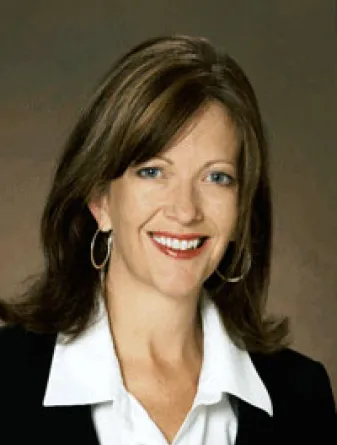 Moe smiling confidently at camera