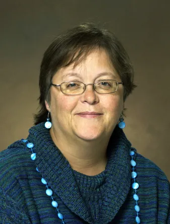 Smith smiling confidently at camera.