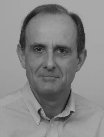 Stuart Croll confidently smiling into the camera.