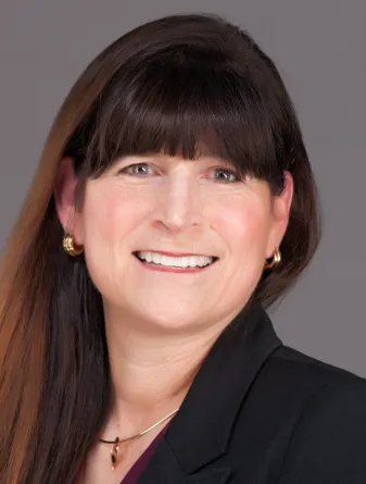 Susan Schaefer Kliman smiling confidently at camera