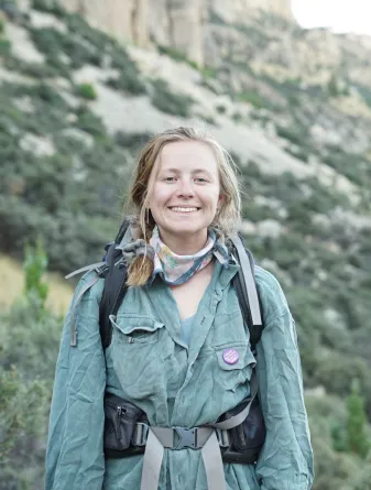 Meredith Johnson smiling confidently while hiking.