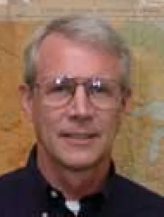 Jim Grier smiling confidently.