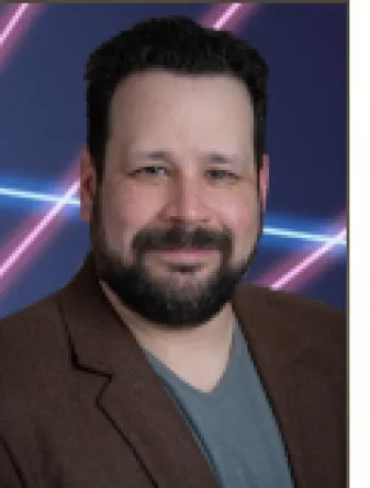 Giancarlo López-Martínez smiling confidently.