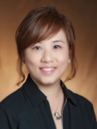 Jiha Kim smiling confidently.