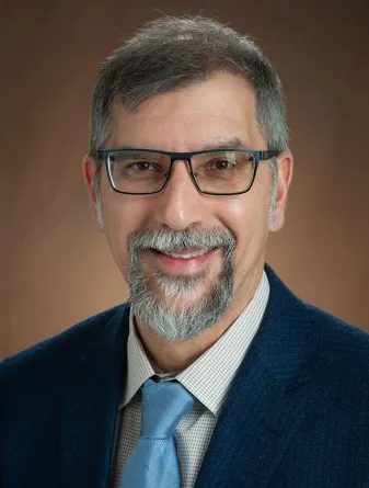 Bernhardt Saini-Eidukat smiling confidently at the camera