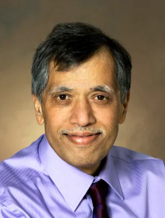 Mukund Sibi smiling confidently at the camera