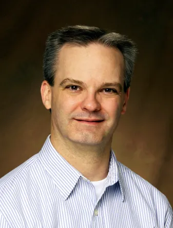 John Wilkinson smiling confidently at the camera