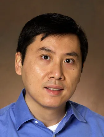 Pinjing Zhao smiling confidently at the camera