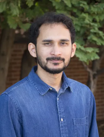 Motasim smiling at the camera