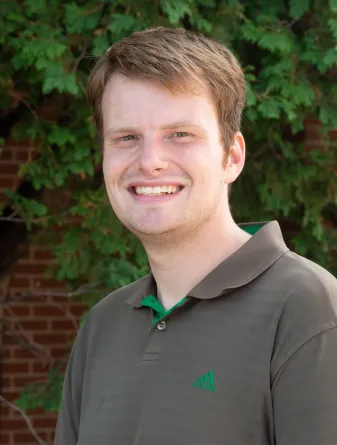 Matthew smiling at the camera