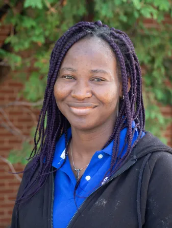 Funmi smiling at the camera