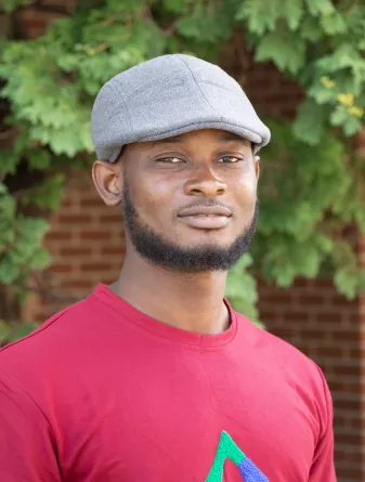 Samuel smiling at the camera