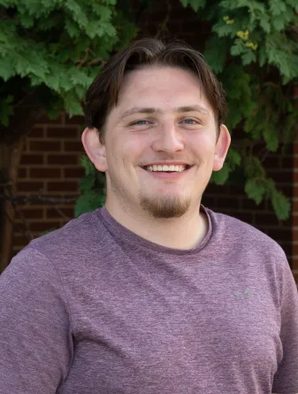 Isaac smiling at the camera