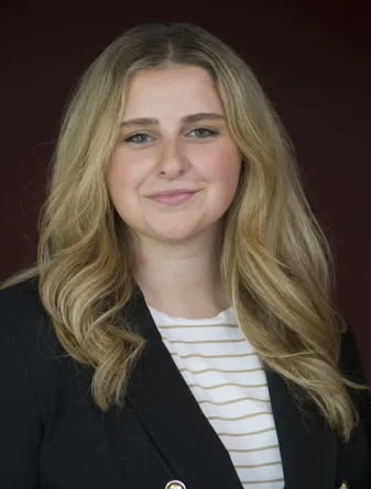 Ava smiling at the camera