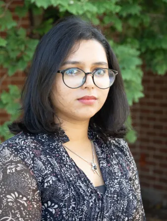 Zakia smiling at the camera