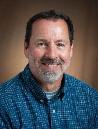 Jeff smiling at the camera