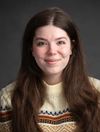 Anna Adkins smiling confidently at the camera